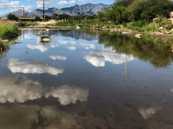 View of Santa Cruz River with clouds reflected in on the surface of the water