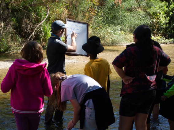 Students learning by the Santa Cruz River
