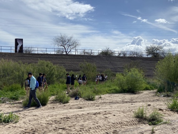 Students on a field trip in the Santa Cruz River in Tucson