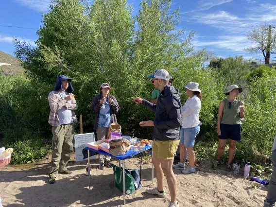 Group of teachers talking by the Santa Cruz River