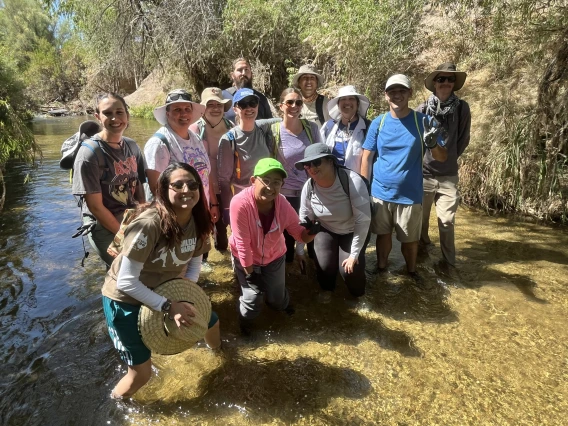 Group of teachers standing in the Santa Cruz River