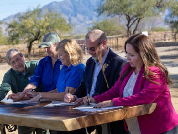 Group signing MOUT. Pictured from left to right: Kevin Dahl, Ward 3 Council Member, City of Tucson; Martha Williams, U.S. Fish and Wildlife Service Director; Amy Lueders, U.S. Fish and Wildlife Service Southwest Regional Director; Bruce Bracker, Santa Cruz County Board of Supervisors; and Adelita S. Grijalva, Chair, Pima County Board of Supervisors.