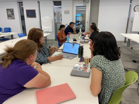 Teachers working together at desks 