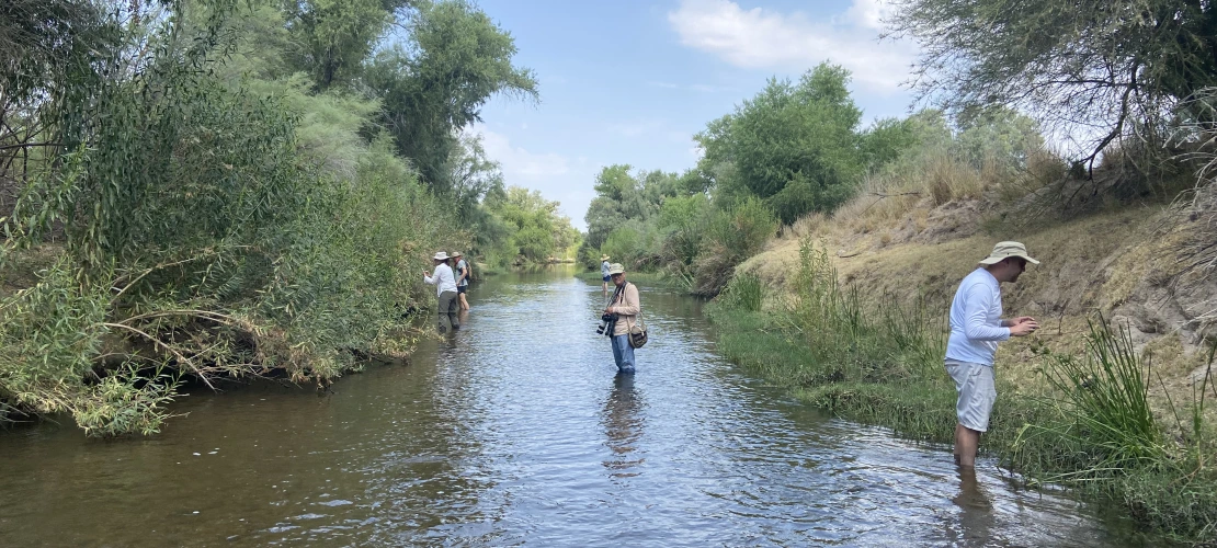 People standing in Santa Cruz river