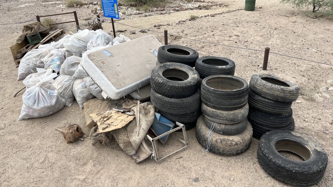 Image of large trash pile and tires collected in the Santa Cruz River