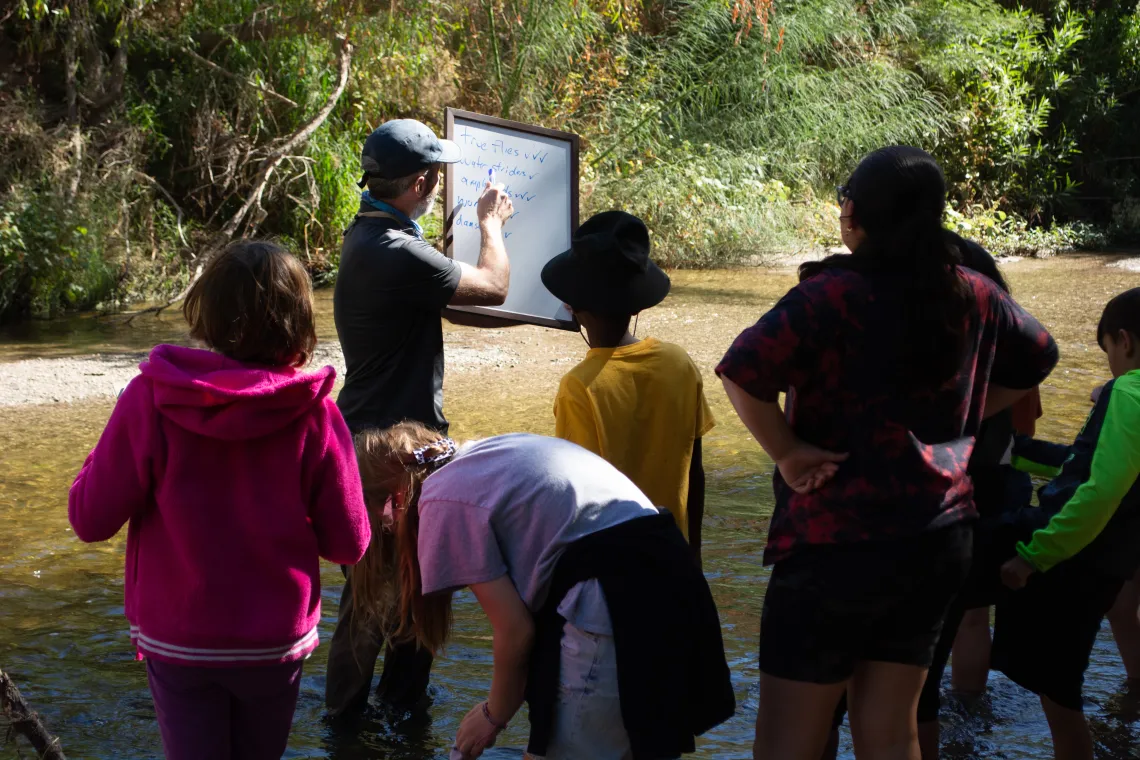 Students learning by the Santa Cruz River