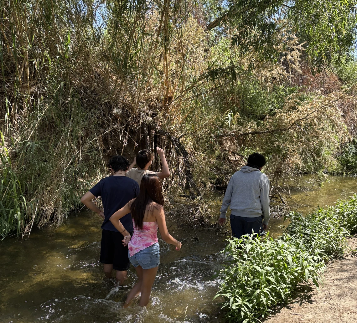 Students walking in the Santa Cruz River on a field trip