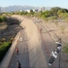 Santa Cruz River with black and white windsocks on the bank